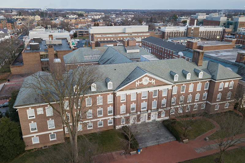 Aerial view of Wolf Hall, a historic red brick building located on The Green at the University of Delaware's main campus in Newark, Delaware.